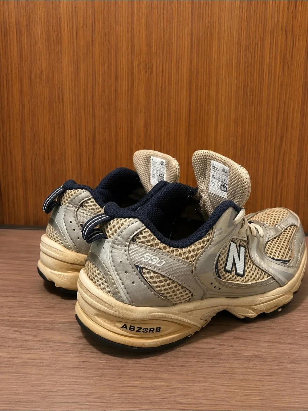 Used good New Balance Kids Beige and Navy 590 Sneaker